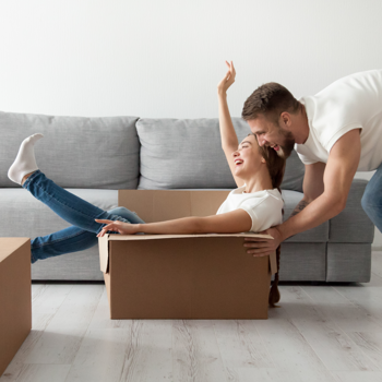 Young couple celebrating their new home.