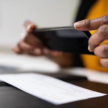 A phone taking picture of a check