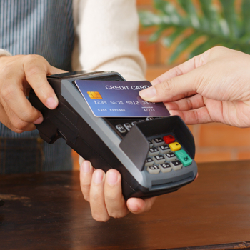 A man paying for something with his credit card