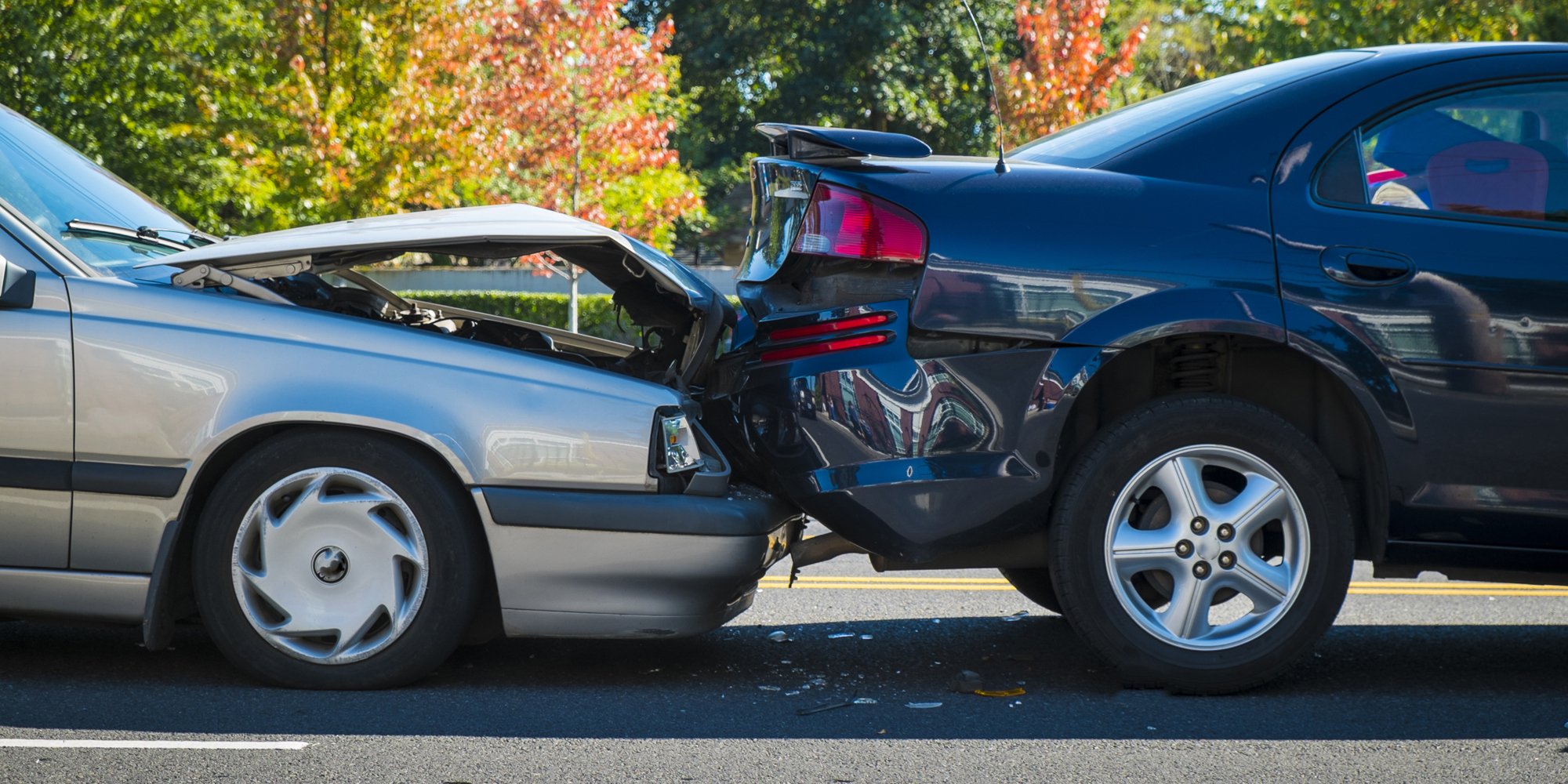 Two cars in a minor accident with crumpled fenders