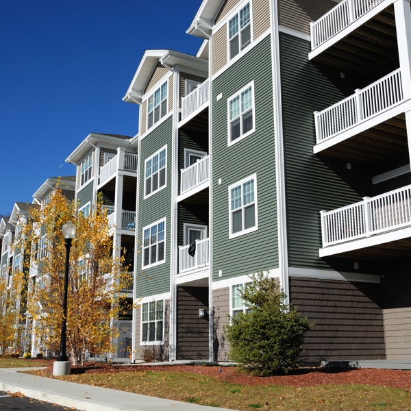 Green apartments with fall trees