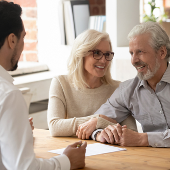 Older couple meeting with a representative