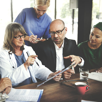 Medical professionals having an interactive staff meeting.