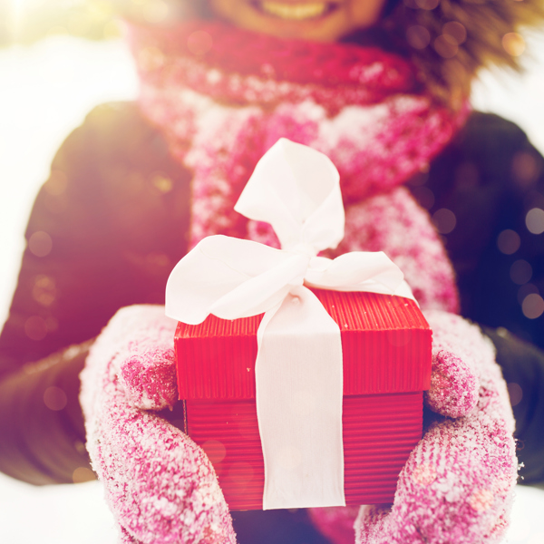 Girl giving a Christmas present
