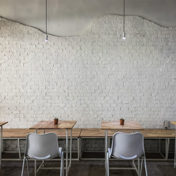 A white brick restaurant wall.