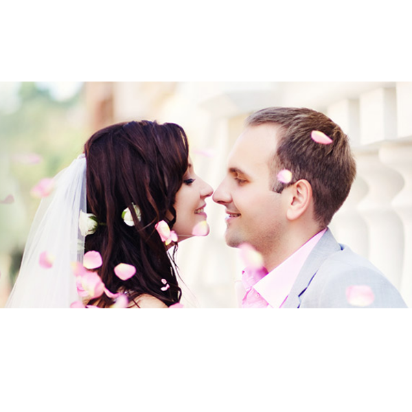 A couple about to kiss for at their wedding