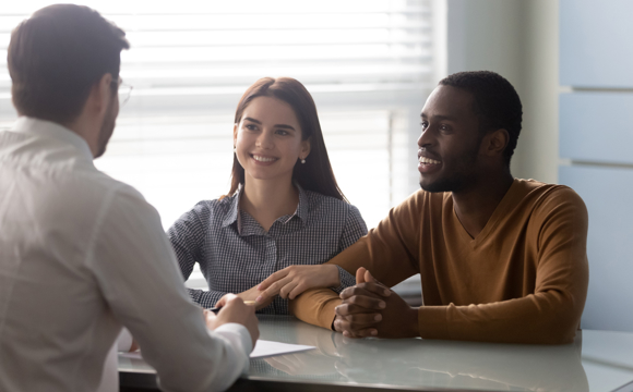 A financial professional with a young couple.