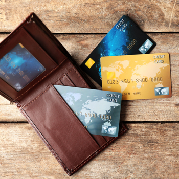 Wallet on a table with cards out.