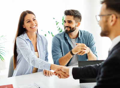 A women shaking the hand of a man