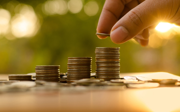 Stacked coins on an outdoor table