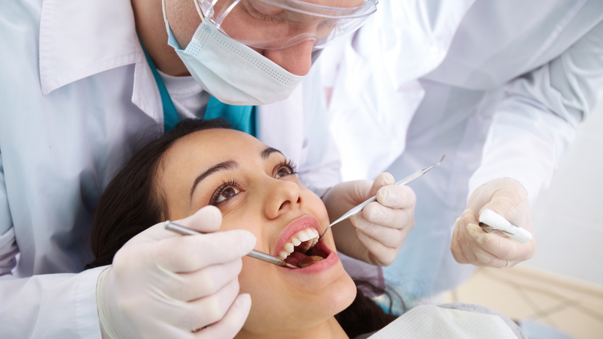 A woman receiving a dental exam