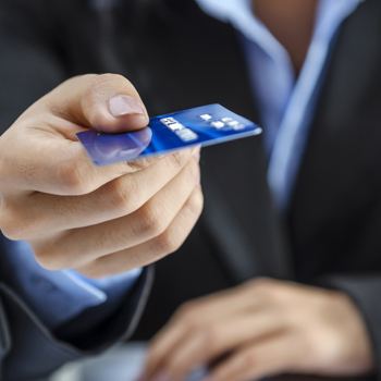 A women handing you a credit card
