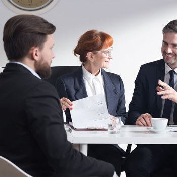 Business professionals meeting in a minimalist conference room